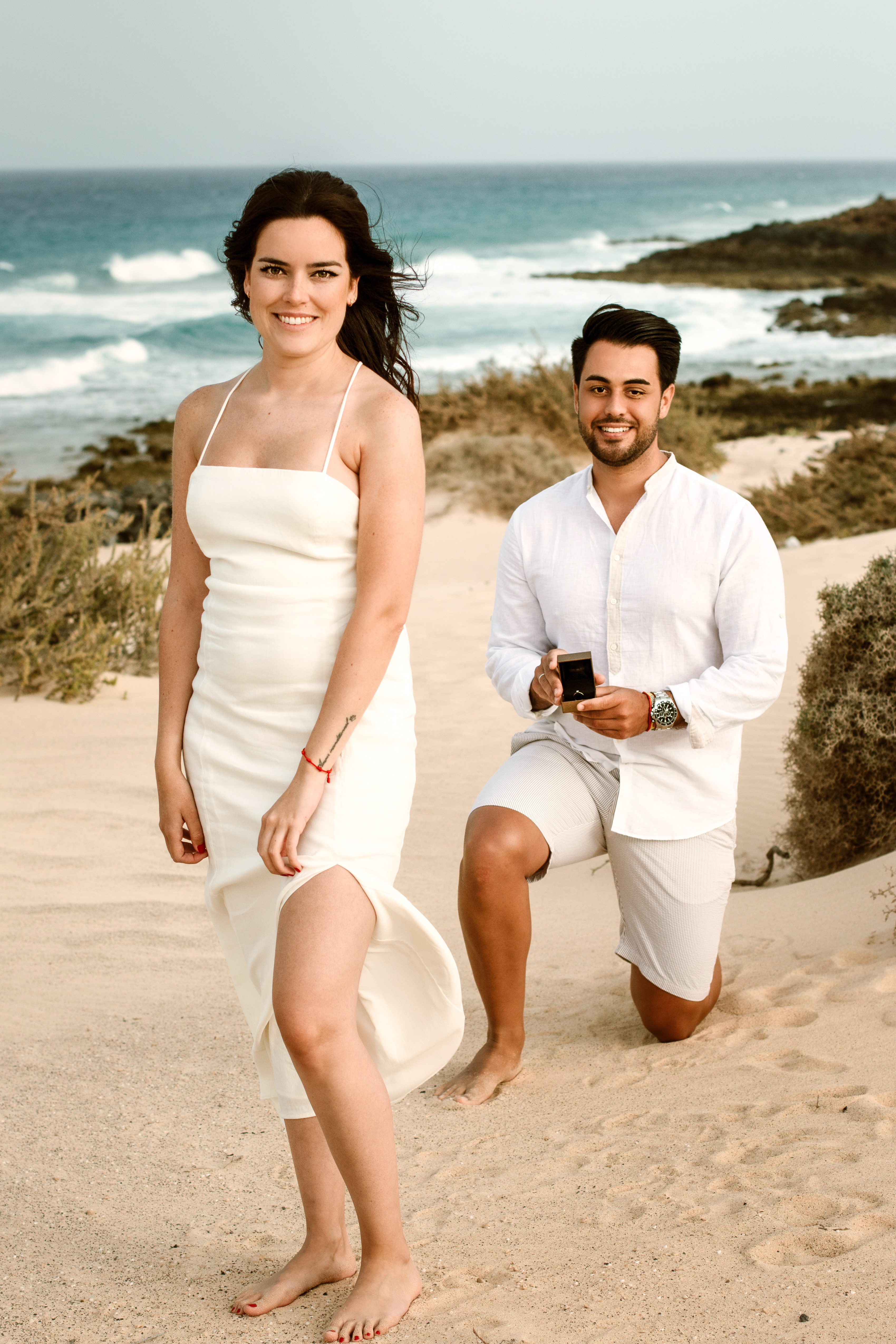 Professional Fuerteventura photography: Couple captured in stunning proposal moment on Grandes Playas - Dunes of Corralejo beach