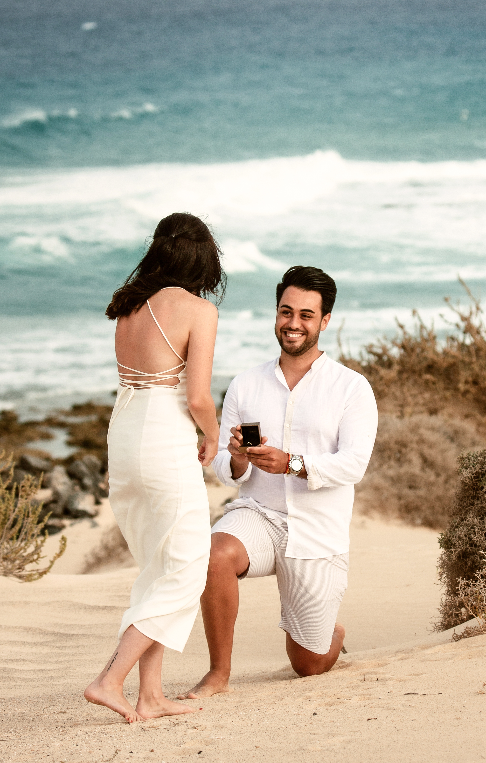 Grandes Playas - Dunes of Corralejo proposal photography: Fuerteventura photographer captures beautiful moment of man proposing to future wife and she says yes